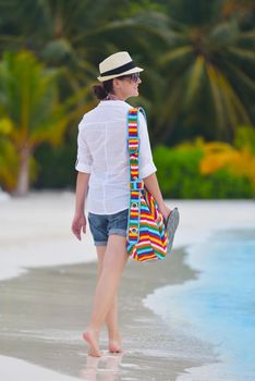 beautifel and happy woman girl on beach have fun and relax on summer vacation  over the beautiful tropical sea