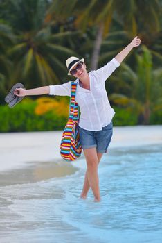 beautifel and happy woman girl on beach have fun and relax on summer vacation  over the beautiful tropical sea