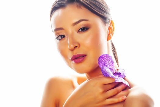 young pretty asian woman with flower purple orchid isolated on white background, spa people concept close up