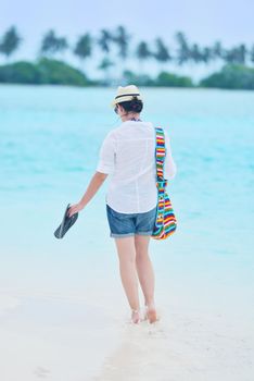 beautifel and happy woman girl on beach have fun and relax on summer vacation  over the beautiful tropical sea