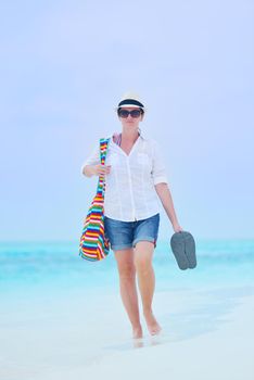 beautifel and happy woman girl on beach have fun and relax on summer vacation  over the beautiful tropical sea