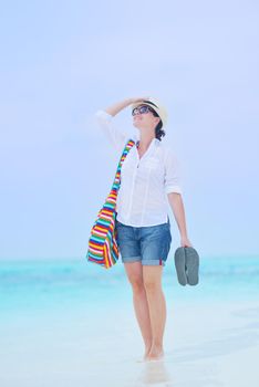 beautifel and happy woman girl on beach have fun and relax on summer vacation  over the beautiful tropical sea