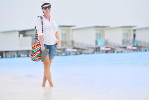 beautifel and happy woman girl on beach have fun and relax on summer vacation  over the beautiful tropical sea