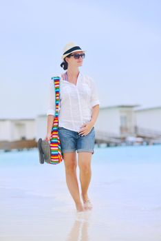 beautifel and happy woman girl on beach have fun and relax on summer vacation  over the beautiful tropical sea