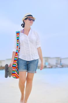 beautiful and happy woman girl on beach have fun and relax on summer vacation  over the sea