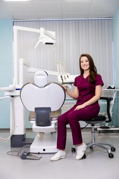 beautiful woman doctor with dental equipment in dentistry. High quality photo