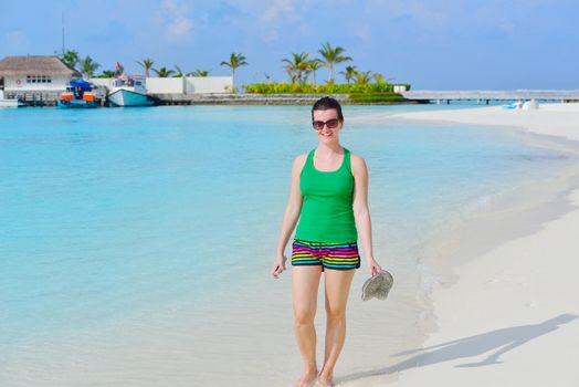 beautifel and happy woman girl on beach have fun and relax on summer vacation  over the beautiful tropical sea