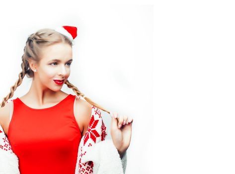 young pretty happy smiling woman on christmas in santas red hat posing isolated on white background, lifestyle people concept closeup