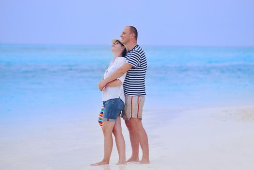 happy young romantic couple in love have fun running and relaxing on beautiful beach