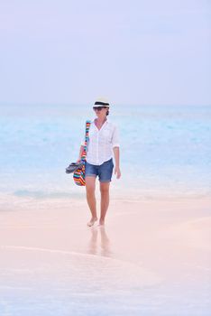 beautifel and happy woman girl on beach have fun and relax on summer vacation  over the beautiful tropical sea