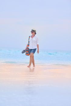 beautifel and happy woman girl on beach have fun and relax on summer vacation  over the beautiful tropical sea