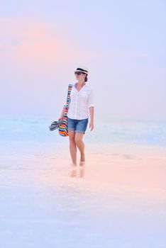 beautifel and happy woman girl on beach have fun and relax on summer vacation  over the beautiful tropical sea