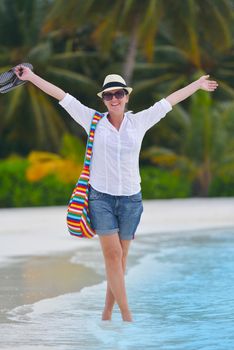 beautifel and happy woman girl on beach have fun and relax on summer vacation  over the beautiful tropical sea