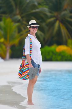 beautifel and happy woman girl on beach have fun and relax on summer vacation  over the beautiful tropical sea