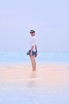 beautifel and happy woman girl on beach have fun and relax on summer vacation  over the beautiful tropical sea