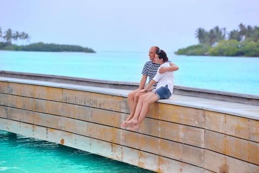 happy young romantic couple in love have fun running and relaxing on beautiful beach