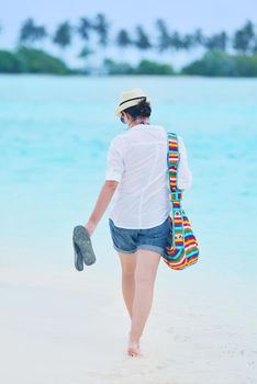 beautifel and happy woman girl on beach have fun and relax on summer vacation  over the beautiful tropical sea