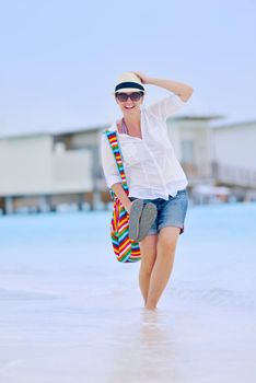 beautifel and happy woman girl on beach have fun and relax on summer vacation  over the beautiful tropical sea