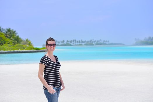 beautifel and happy woman girl on beach have fun and relax on summer vacation  over the beautiful tropical sea