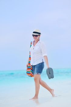 beautifel and happy woman girl on beach have fun and relax on summer vacation  over the beautiful tropical sea