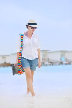 beautiful and happy woman girl on beach have fun and relax on summer vacation  over the sea