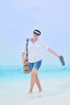 beautifel and happy woman girl on beach have fun and relax on summer vacation  over the beautiful tropical sea