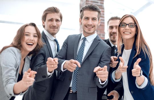 Business team is using putting fingers together and smiling while working in office