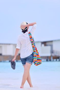 beautiful and happy woman girl on beach have fun and relax on summer vacation  over the sea