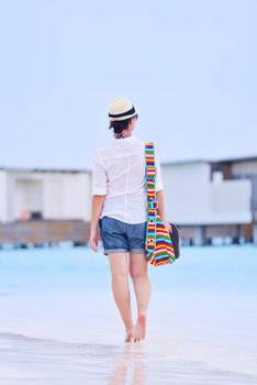 beautiful and happy woman girl on beach have fun and relax on summer vacation  over the sea