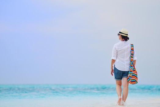 beautifel and happy woman girl on beach have fun and relax on summer vacation  over the beautiful tropical sea