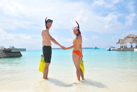 happy young romantic couple in love have fun running and relaxing on beautiful beach