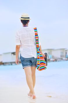 beautiful and happy woman girl on beach have fun and relax on summer vacation  over the sea