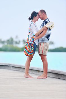 happy young romantic couple in love have fun running and relaxing on beautiful beach