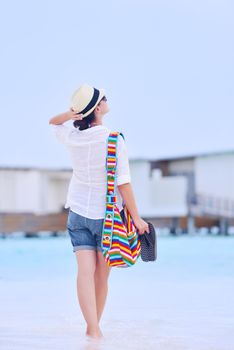 beautiful and happy woman girl on beach have fun and relax on summer vacation  over the sea