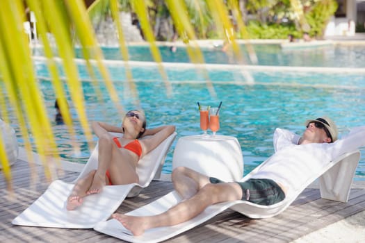 happy young romantic couple in love have fun running and relaxing on beautiful beach