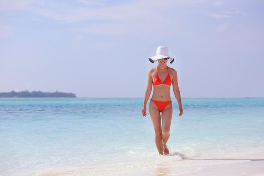 beautiful and happy woman girl on beach have fun and relax on summer vacation  over the sea