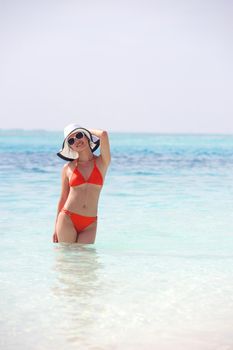 beautiful and happy woman girl on beach have fun and relax on summer vacation  over the sea