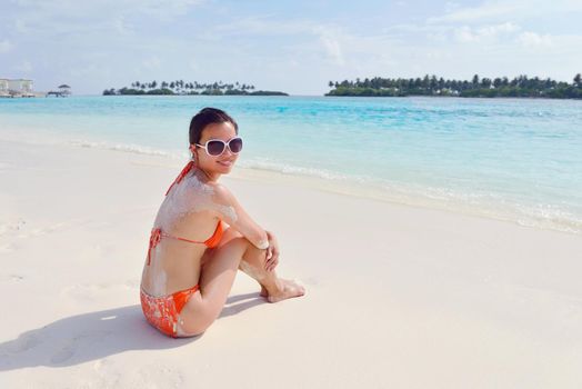 beautiful and happy woman girl on beach have fun and relax on summer vacation  over the sea