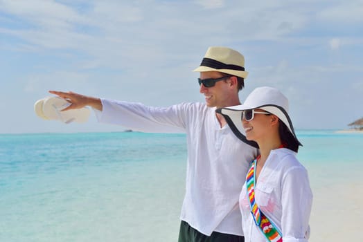 happy young romantic couple in love have fun running and relaxing on beautiful beach