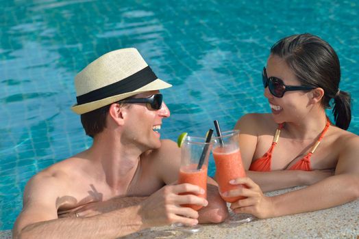 happy young couple relax and take fresh drink at summer vacation