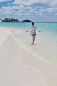 happy young woman on summer vacation on beautiful tropical beach have fun and relax