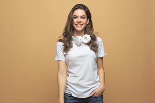 Portrait of young beautiful cheerful girl smiling looking at camera over gray background