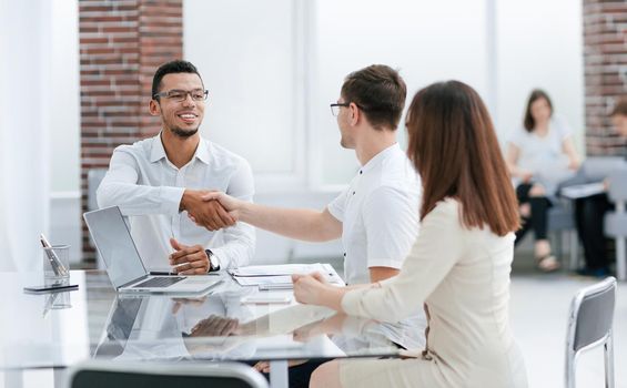 business people sitting in the lobby of the business center . concept of partnership