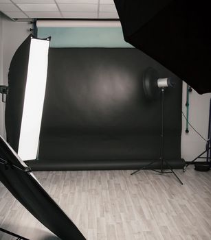 Empty photo Studio with a variety of lighting equipment. photo with copy space