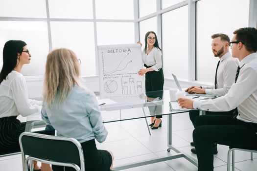 businesswoman doing a presentation for the employees of the company. the concept of a startup