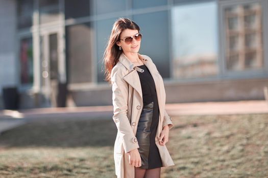 young business woman standing on the street near the office building . business people