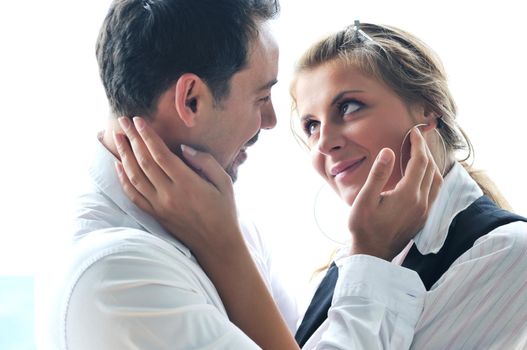 romantic happy couple relax and have fun at balcony in their new home apartment