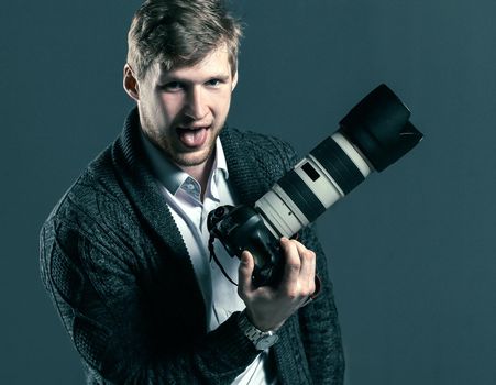 creative photographer sitting on an office chair.isolated on grey background.