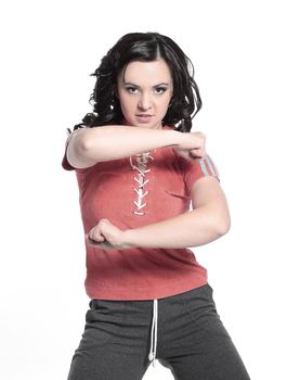 portrait of a charming woman in a tracksuit.isolated on white background.