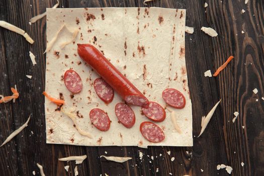 salami sliced on pita bread.preparation of Shawarma. photo with copy space.